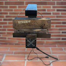 The DC is used most effectively in the upright vertical position where it naturally convects drawing air in the bottom and emitting it hot out the top.

Even with the fan off not blowing, or fanless with the fan removed it still naturally convects.