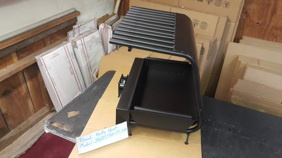 24GR20TD 24 inch wide GR fireplace grate heater with blower, 12 tubes, 20 inch tall/deep, shown with fireback and ash tray, rear view