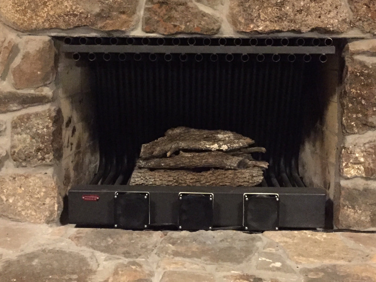 36DGR24TD 36 inch wide DGR double row fireplace grate heater with blower, 35 tubes, 24 inch tall/deep, installed in a stone fireplace