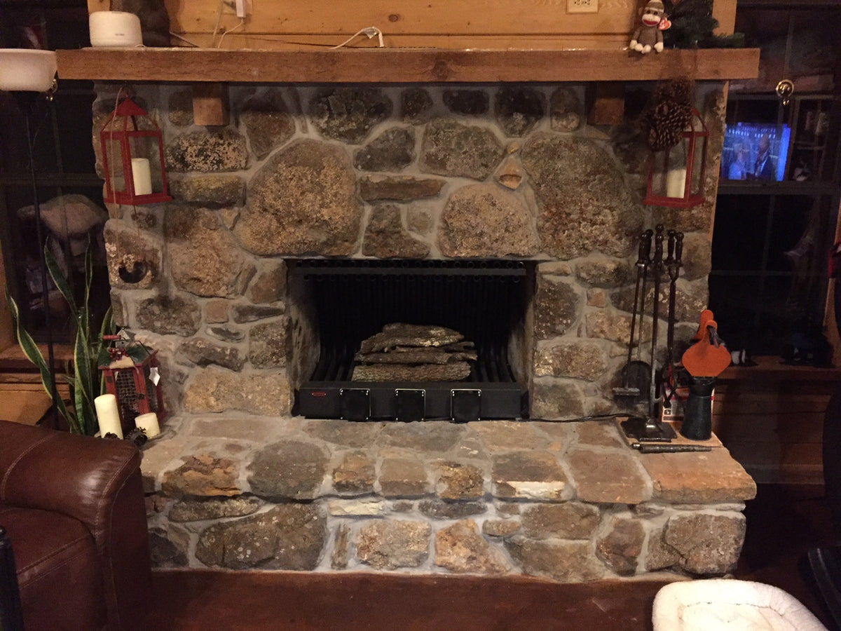 36DGR24TD 36 inch wide DGR double row fireplace grate heater with blower, 35 tubes, 24 inch tall/deep, installed in a stone fireplace, wide view